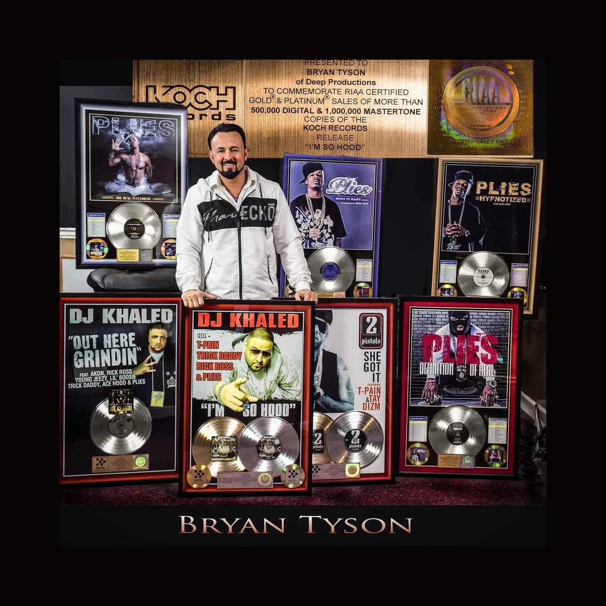 Bryan Tyson with his gold and platinum plaques at Deep Productions